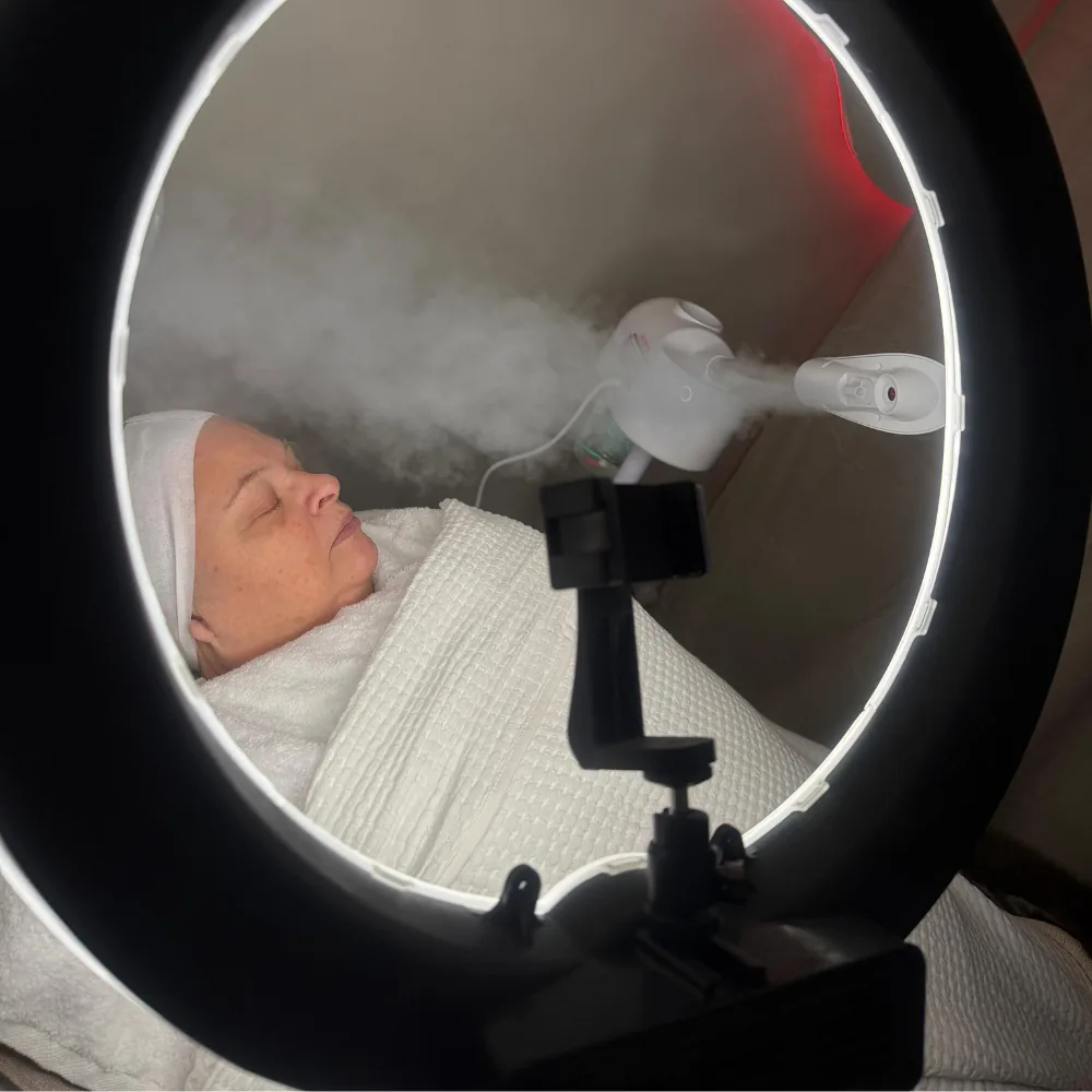 A client receiving a facial treatment at the Karrina Crystal skin clinic